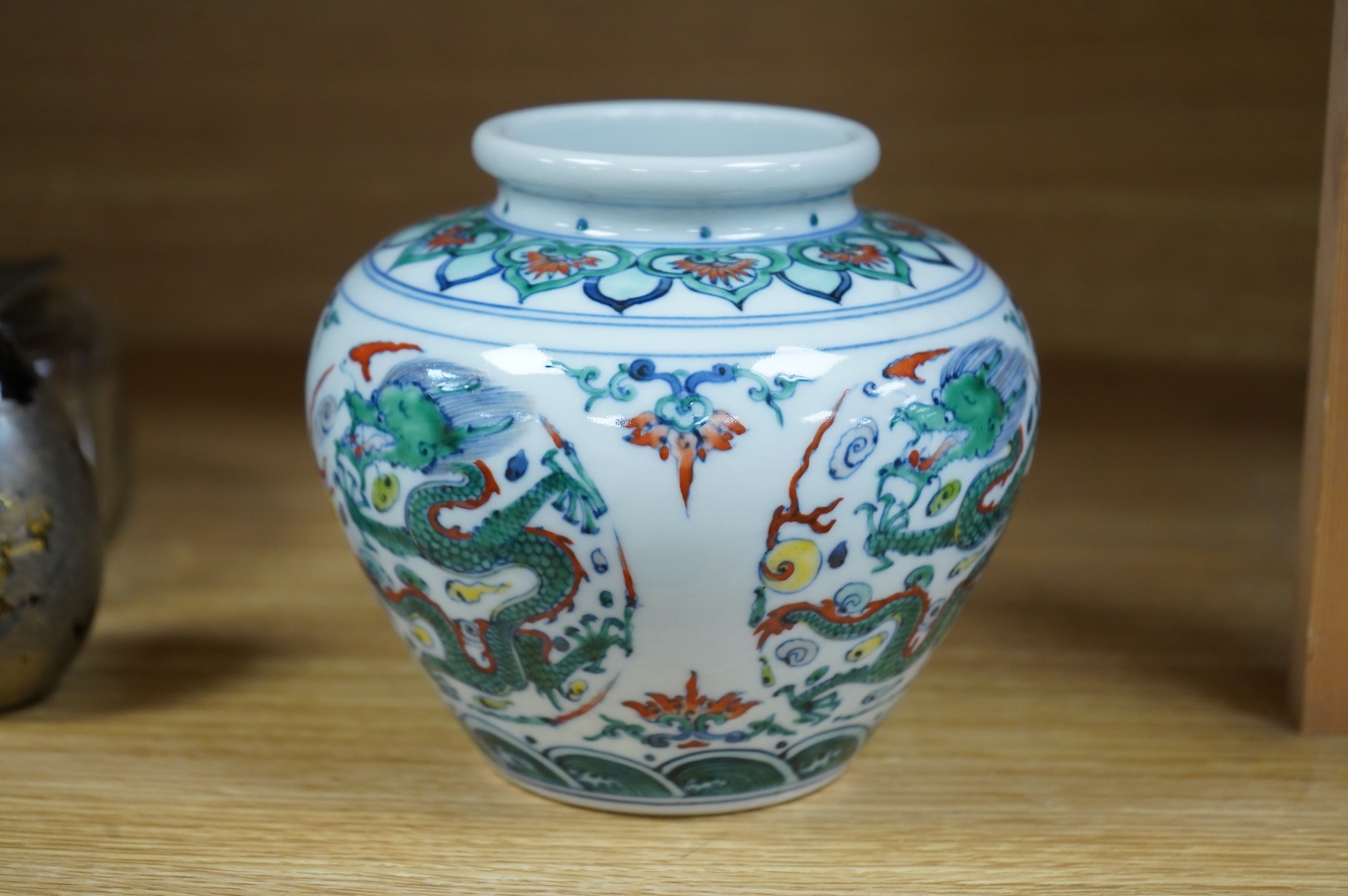 A Chinese doucai 'dragon' roundel vase, Kangxi mark but later, 13cm